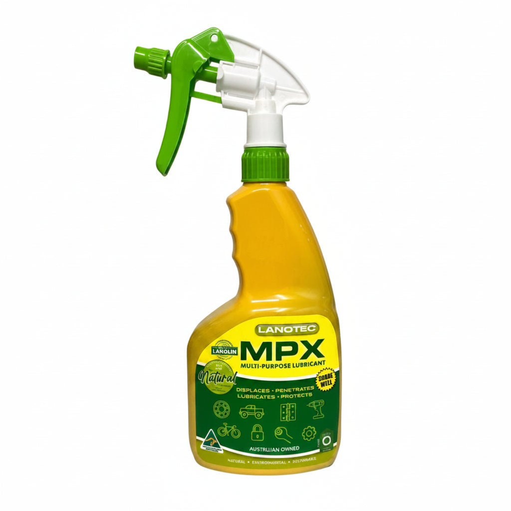 Yellow and green spray bottle with a white nozzle on a white background